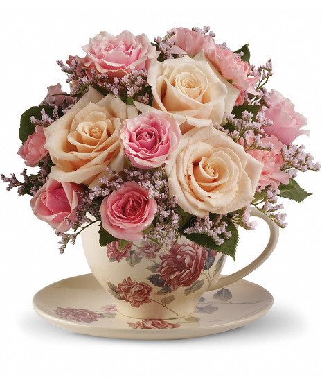 Pink and cream flowers in a reusable teacup and saucer