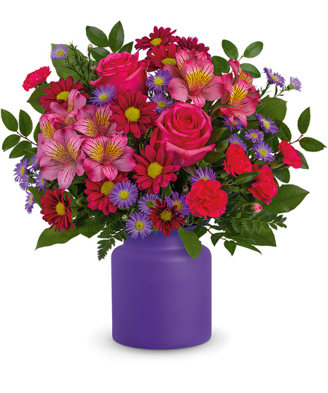 Pink and purple flowers in a purple vase