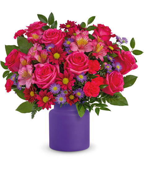 Pink and purple flowers in a purple vase