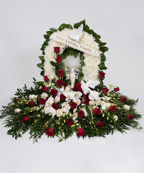 Red and White Funeral Arrangement with Roses and Orchids
