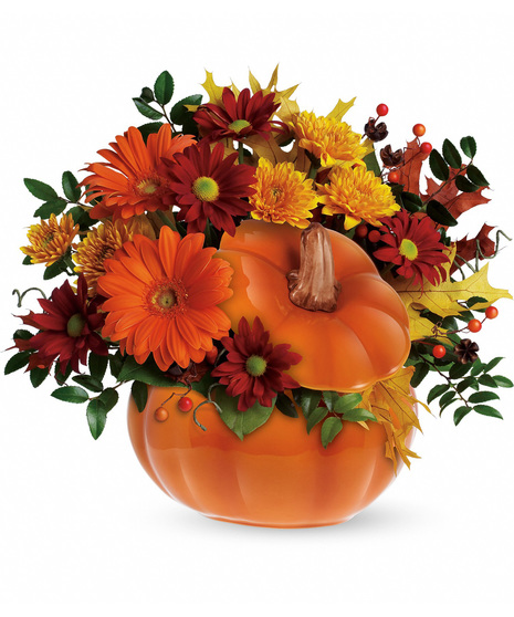 Fall flowers in a re-usable orange pumpkin vase