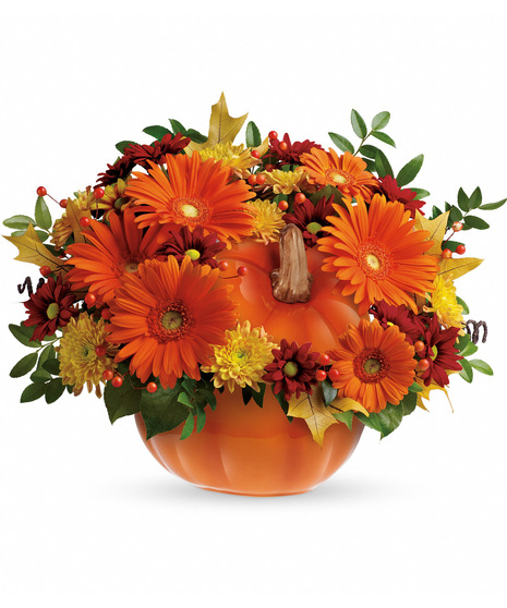 Fall flowers in a re-usable orange pumpkin vase