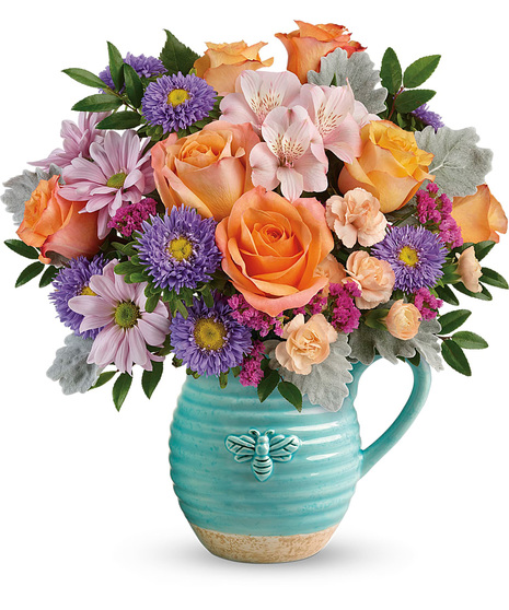 Spring flowers in a cute pitcher