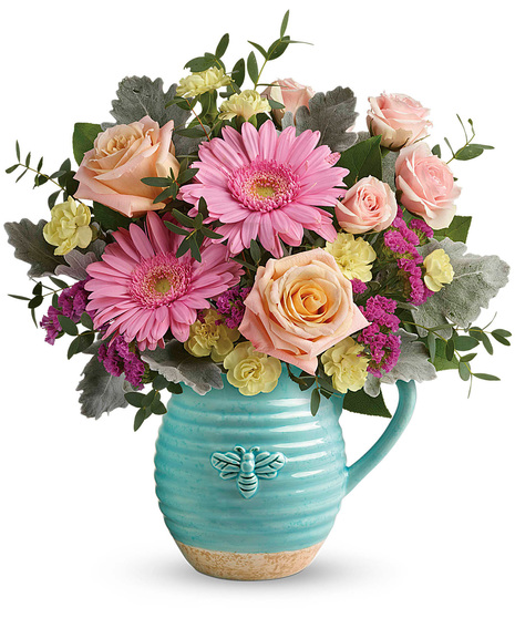 Spring flowers arranged in a reusable pitcher