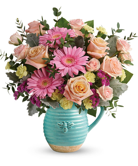 Spring flowers arranged in a reusable pitcher