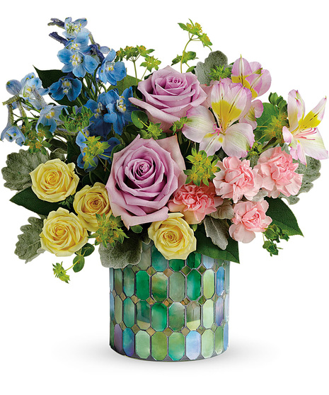 Fresh flowers in a designer mosaic vase