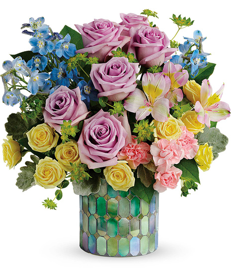Fresh flowers in a designer mosaic vase