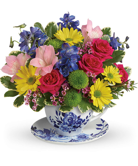 Bright Flowers in a Teacup with Saucer
