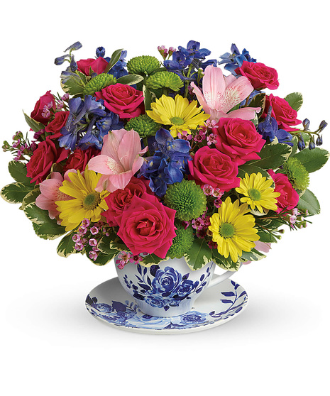 Bright Flowers in a Teacup with Saucer